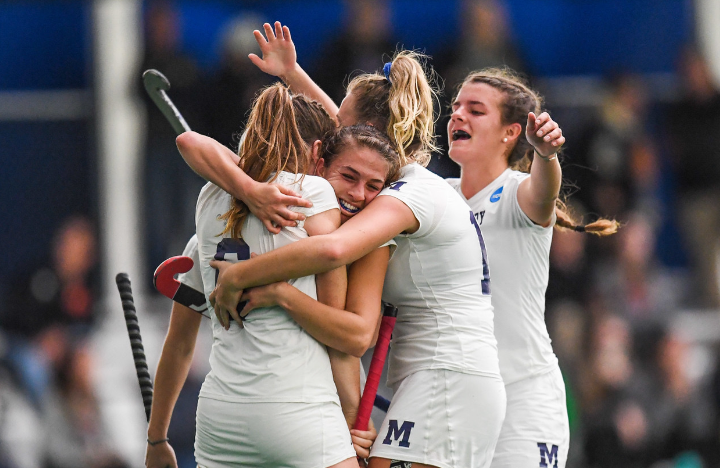 Team hugging after a win